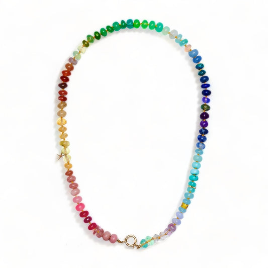 rainbow gemstone necklace with a gold charm